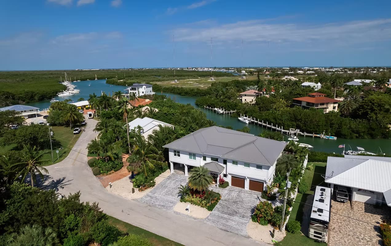Aerial view of a private deep-water dock and boat slip engineered by Campbell Engineering Consultants along a mangrove shoreline in the Florida Keys